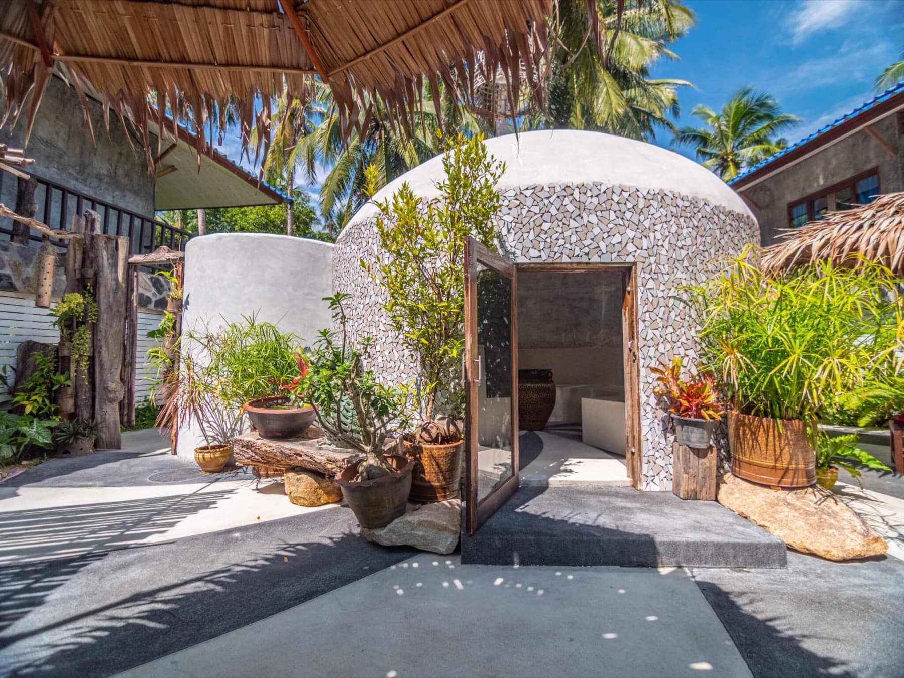 The dome-shaped herbal steam sauna with open door