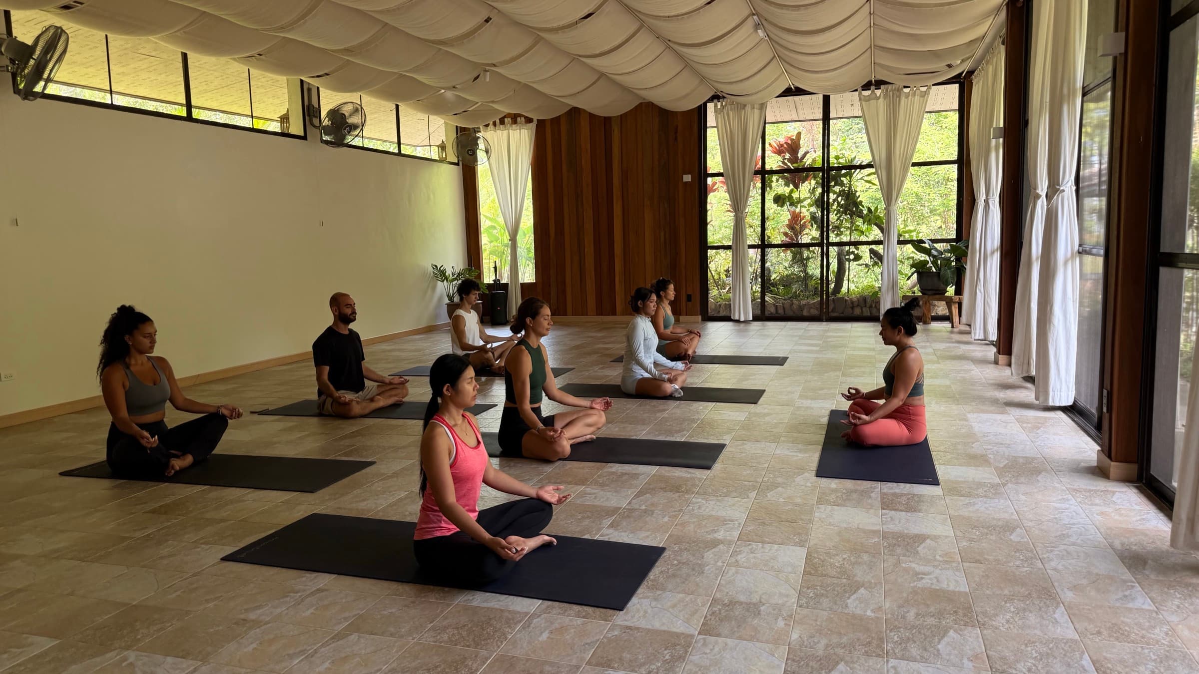 A light-filled yoga shala ready for a hosted retreat